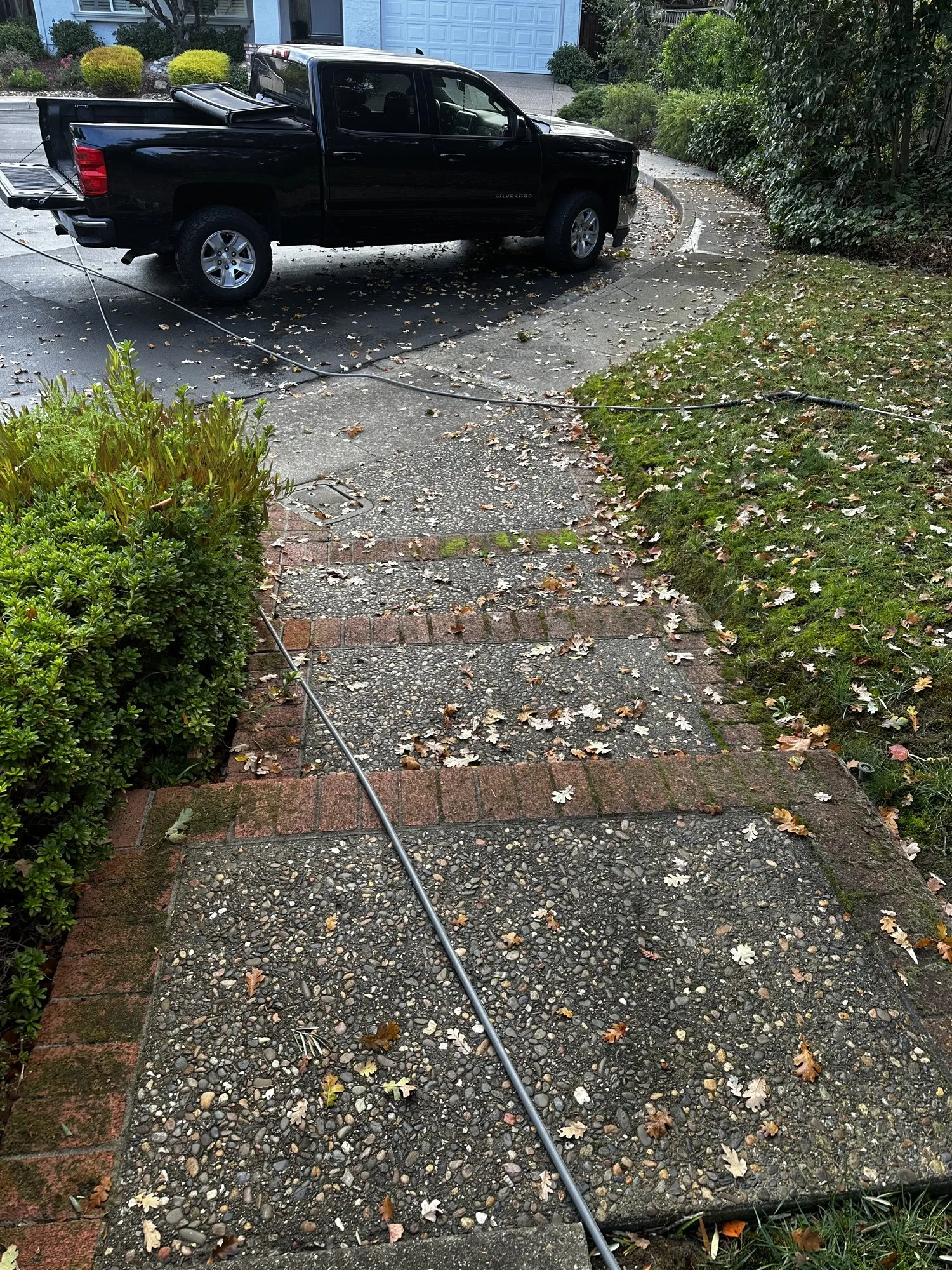 Aggregate walkway and brick bands — before