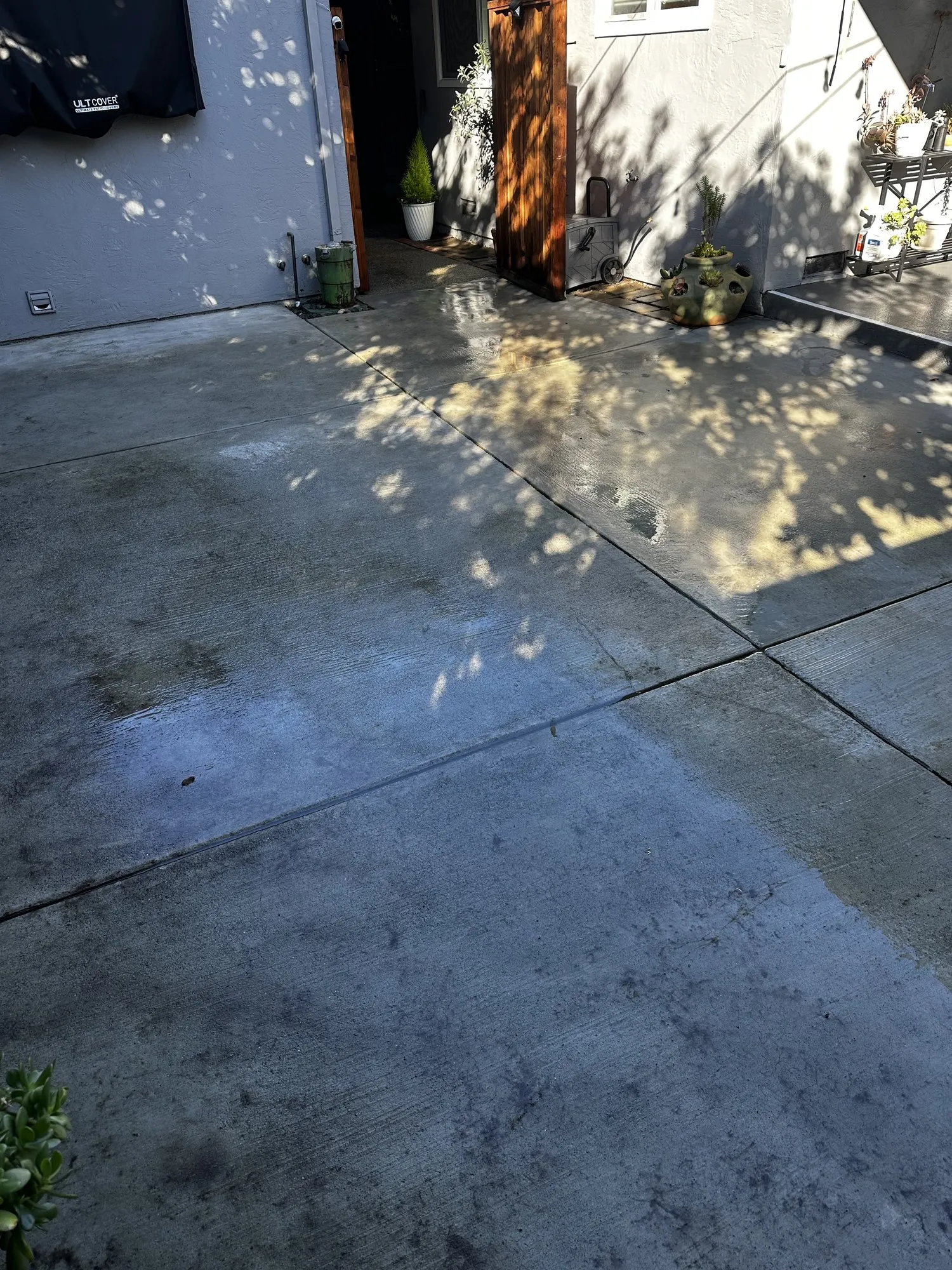 The same patio, from the fence — after