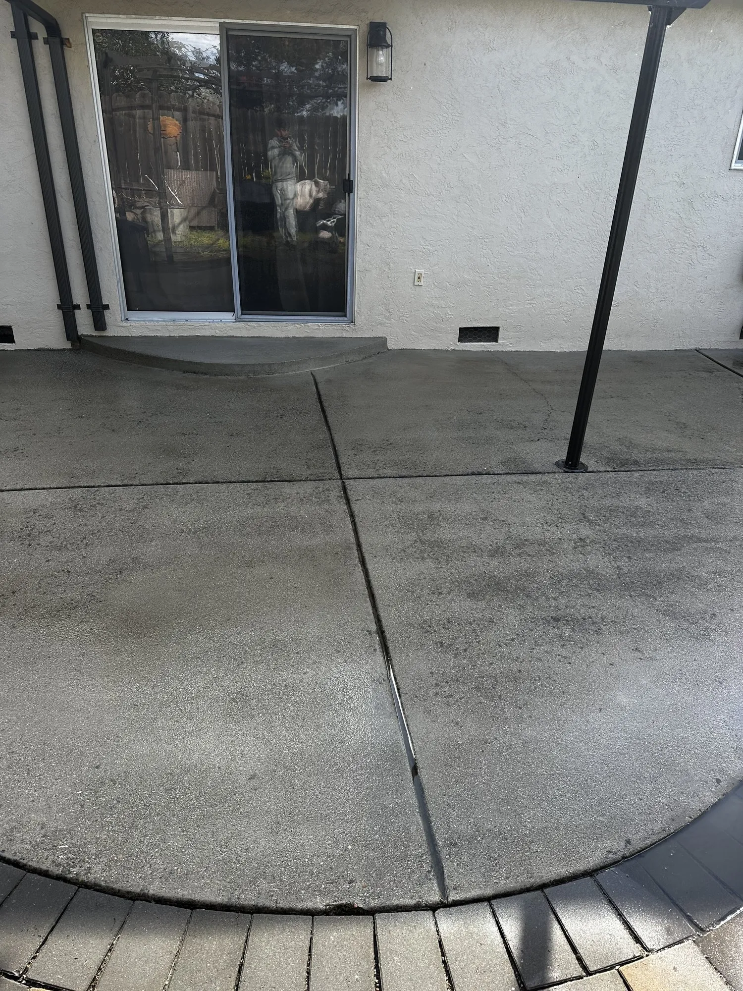 Grimed-in concrete patio — after