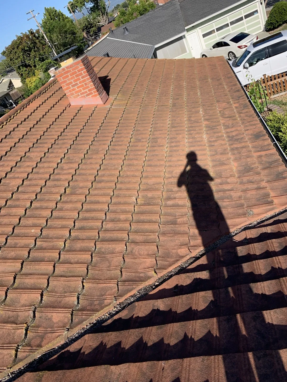 Black Shark at work on a Spanish tile roof in San Jose
