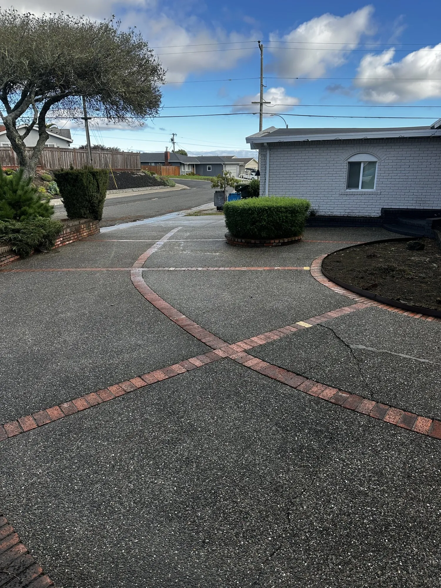The same driveway, toward the street — after